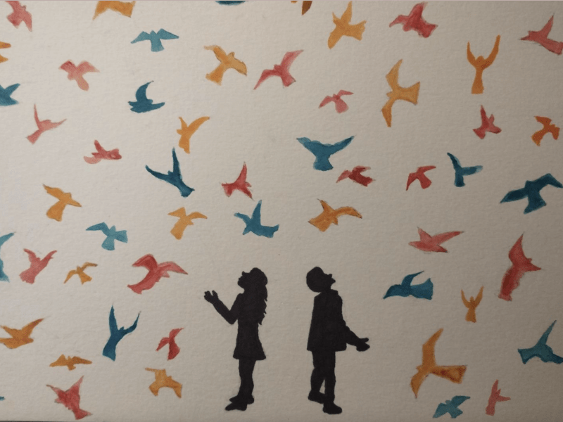 Image of two silhouettes on a white background with colorful birds.