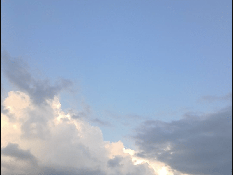Image of clouds against a blue sky.
