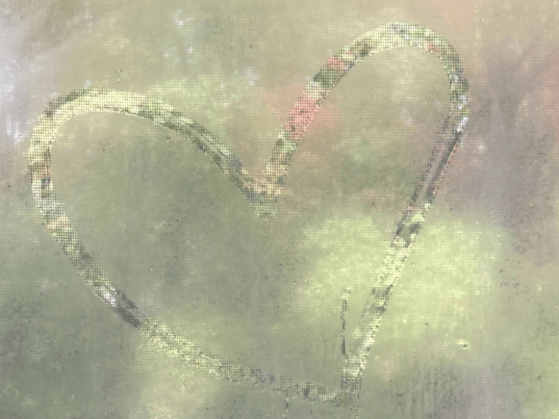 Image of a heart drawn in a window.
