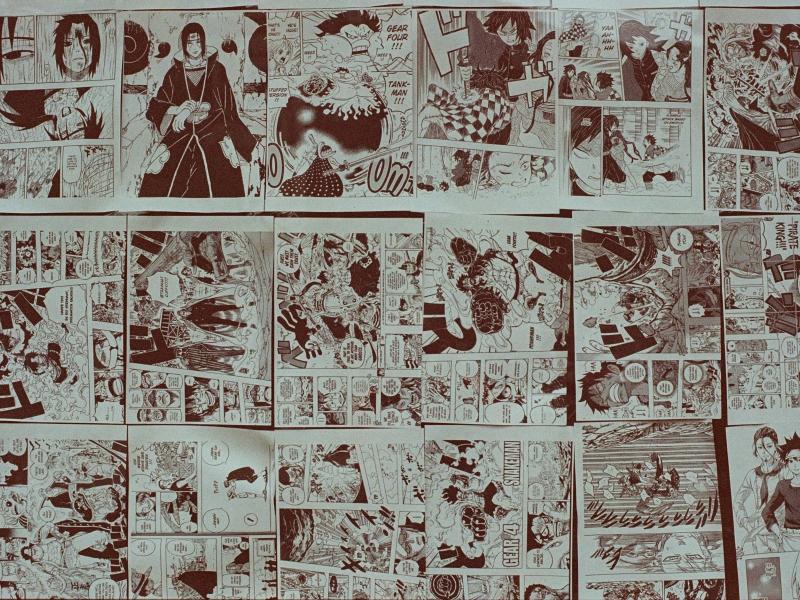 Comics spread out on a table.