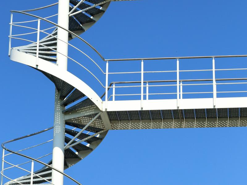 Image of a curving stairway that is outside.