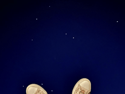 Image of shoes pasted on top of the night sky.