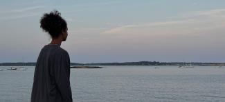 Girl looking at the ocean