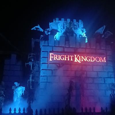 A building with fog and lights and halloween decorations