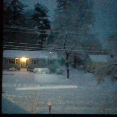 A window which looks outward to a snow-covered street